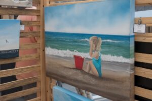 kid on beach painting