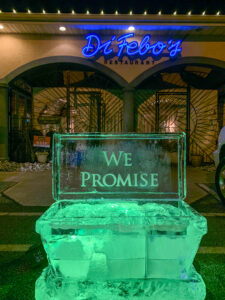an ice sculpture that reads we promote