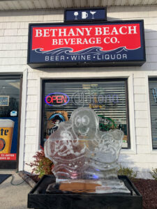 a large ice sculpture in front of a beverage shop