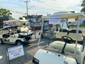 several golf carts parked in a parking lot