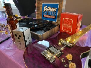 a purple guitar sitting on top of a table