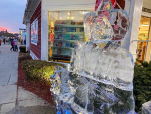 an ice sculpture sitting on the side of a road