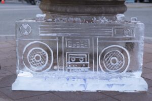 an ice sculpture of a boombox on the sidewalk