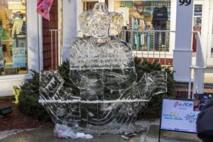 a large ice sculpture sitting in front of a store