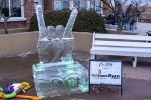 an ice sculpture of a woman holding a baby