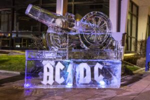 an ice sculpture with letters and wheels on it