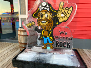 an ice sculpture of a pirate holding a rock