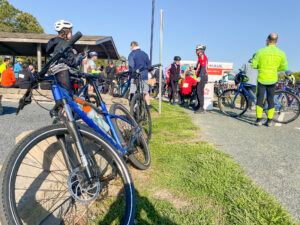 a group of bicyclists are gathered at a bike event