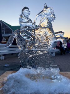 an ice sculpture of a man riding a horse