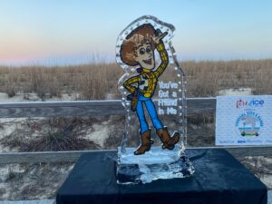 a frosted glass figure of a cowboy holding a gun