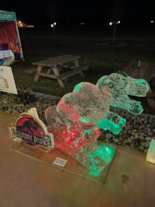 a couple of ice sculptures sitting on top of a wooden table