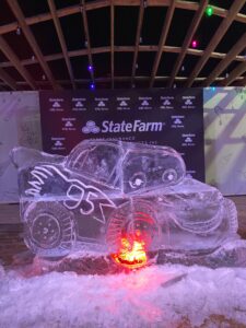 a car made out of ice sitting on top of snow