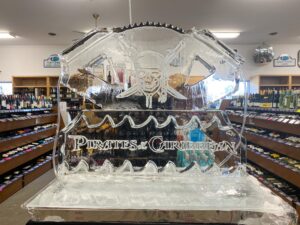 a large ice sculpture in a store filled with bottles
