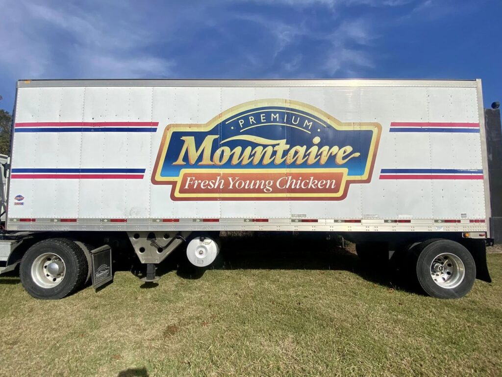 a truck with the words mountaine fresh young chicken on it