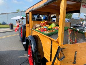 an old fashioned truck is loaded with fresh produce