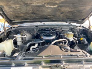 the engine compartment of a car with its hood open