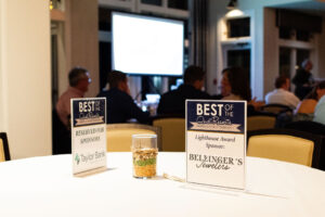 a table with two signs on it that say best of the best