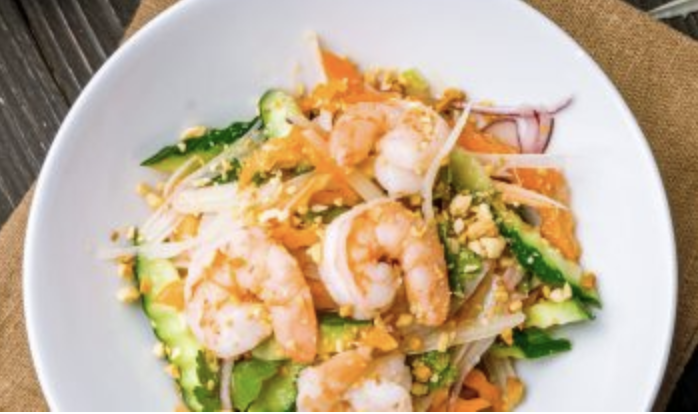 a white plate topped with shrimp and veggies