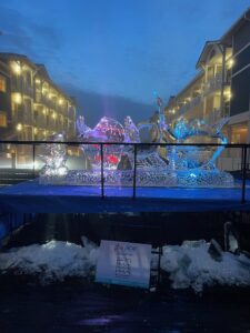 an ice sculpture is displayed in front of a building
