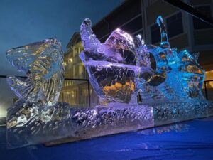 three ice sculptures sitting in front of a building
