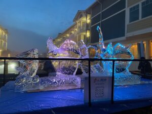 an ice sculpture of two fish and a boat