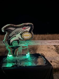 a lighted fish sculpture on top of a table
