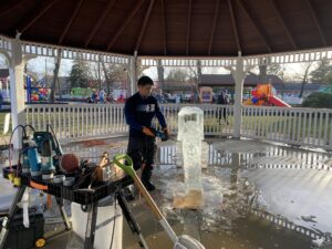 a man is cleaning up the inside of a gazebo