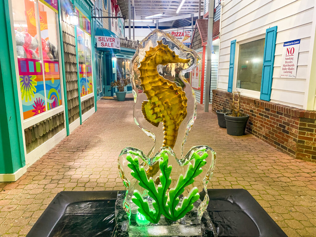 a seahorse sculpture in the middle of a shopping mall
