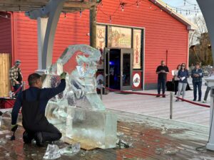 a man is working on an ice sculpture
