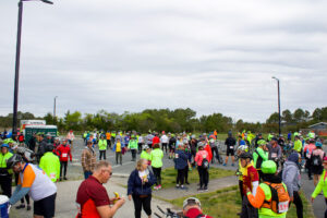 a large group of people walking down a street