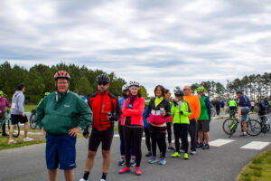 a group of people standing next to each other on a road