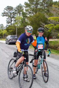 two people on bikes posing for a photo