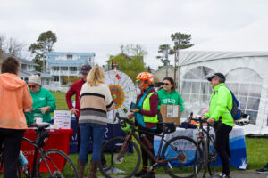 a group of people standing around with bikes