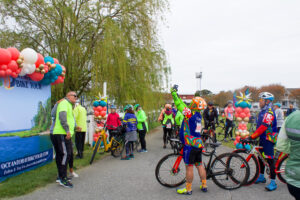 a group of bicyclists are lined up at the finish line