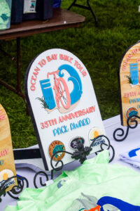 a table topped with surfboards and other items