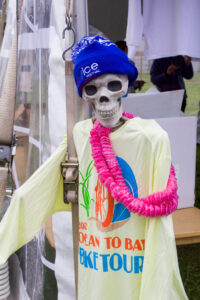 a skeleton wearing a blue hat and yellow shirt