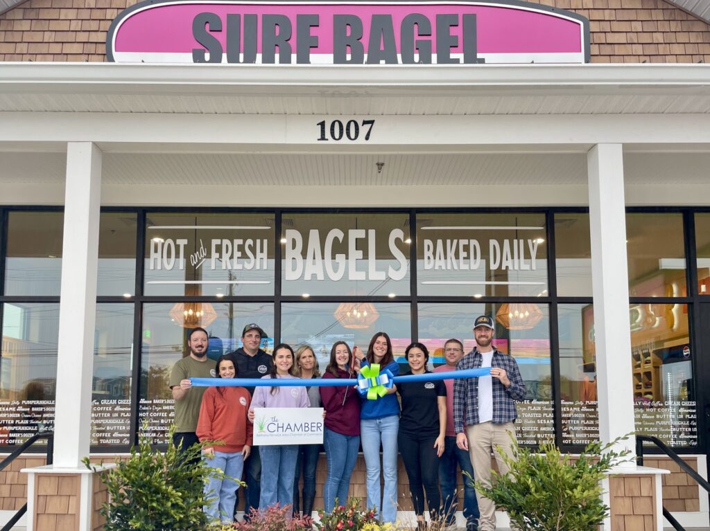 a group of people standing in front of a store